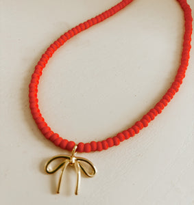 Coral Beaded Bow Necklace